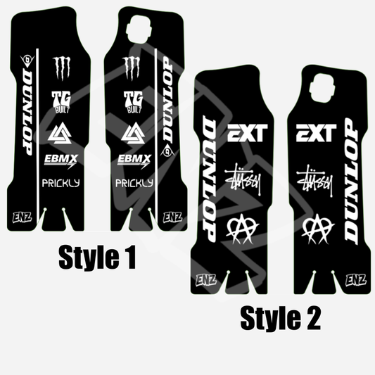 Two styles of black and white emoto fork decals with various brand logos on a white background.